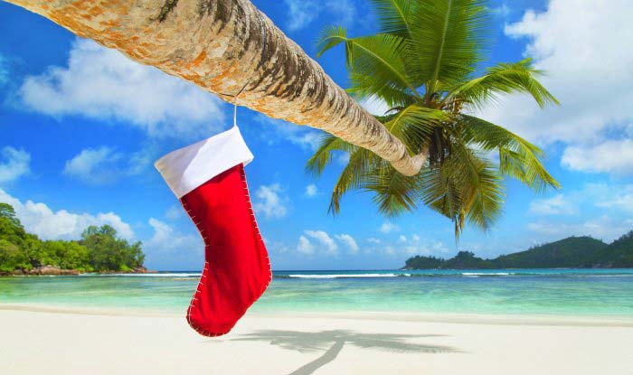 Christmas presents and stocking on the beach