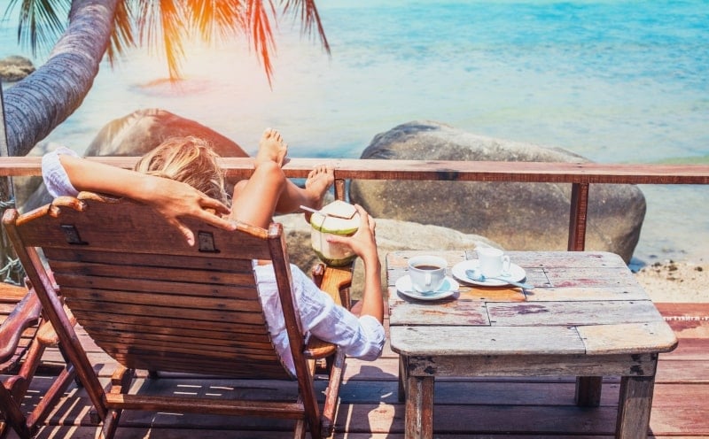 Woman having breakfast on the balcony