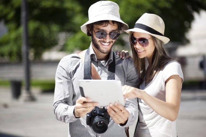 Couple with tablet travelling